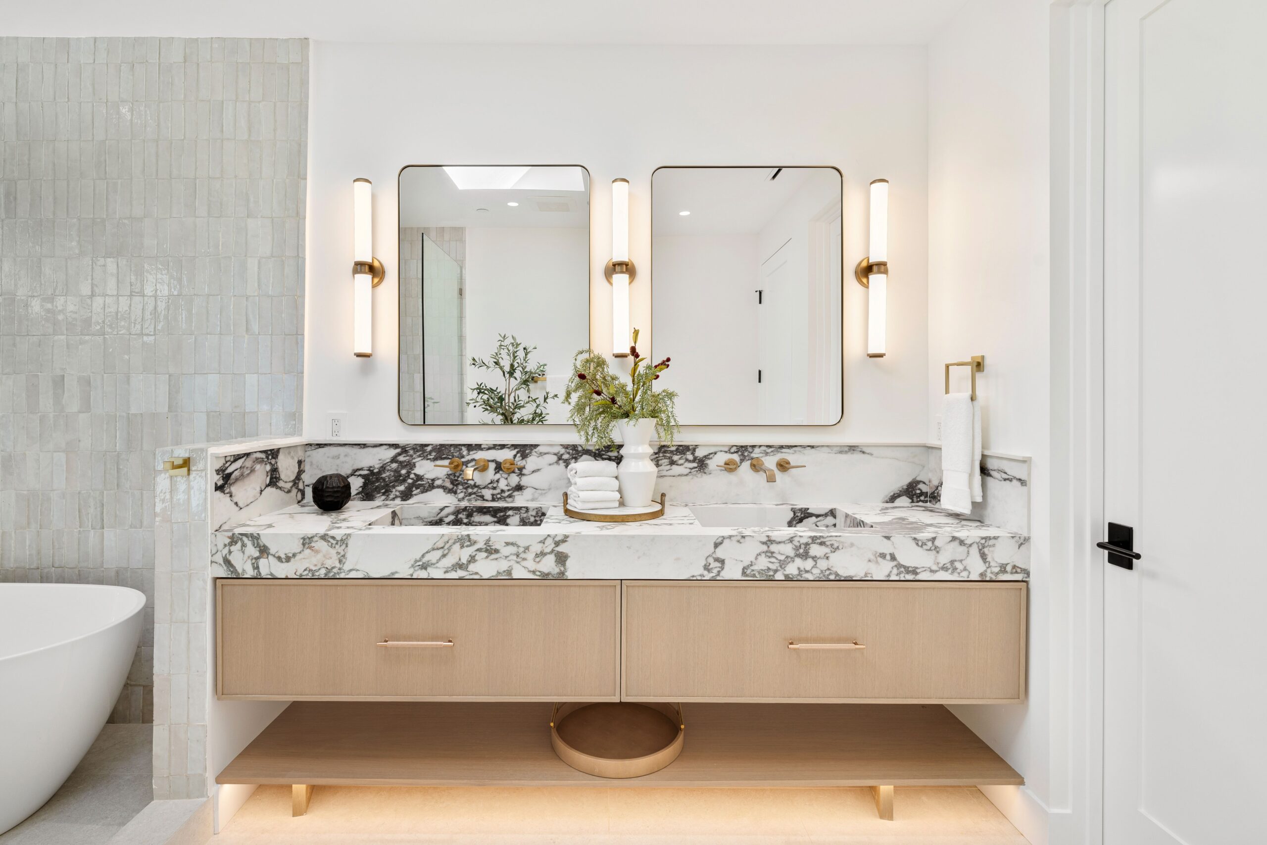 modern,bathroom,with,marble,countertop,,dual,mirrors,,and,elegant,lighting,
